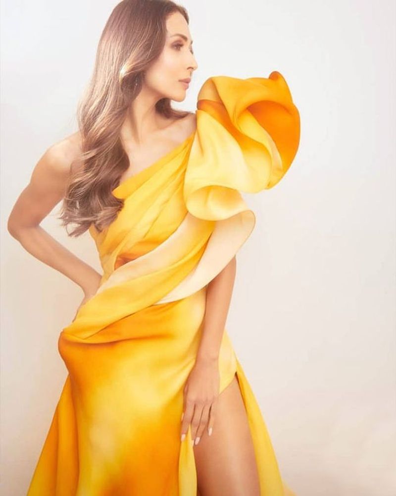 Malaika Arora in yellow one-shoulder thigh-slit dress