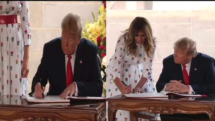 US President Donald Trump and Melania write in the visitor book at Raj Ghat KPP US President Donald Trump and Melania write in the visitor book at Raj Ghat KPP