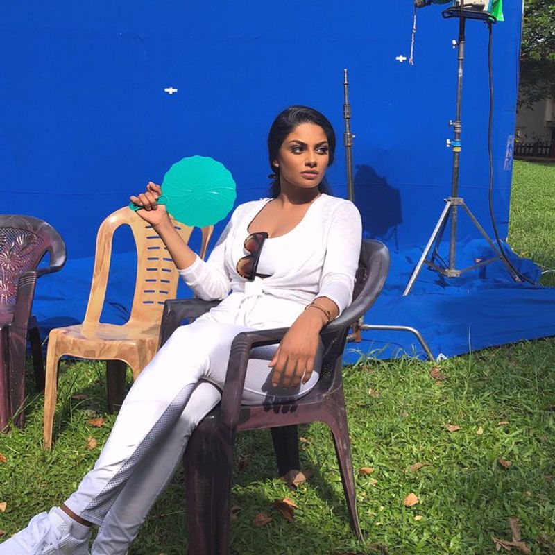 Tamil actress who plays rugby in a dark room with cricketers
