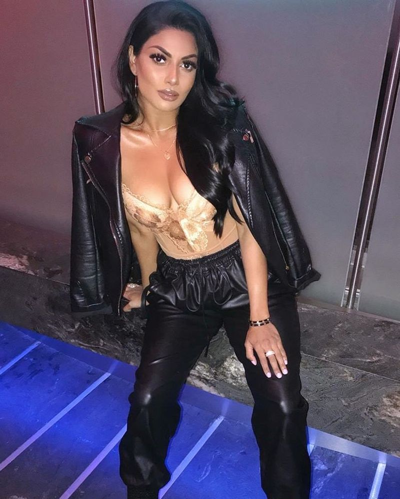 Tamil actress who plays rugby in a dark room with cricketers