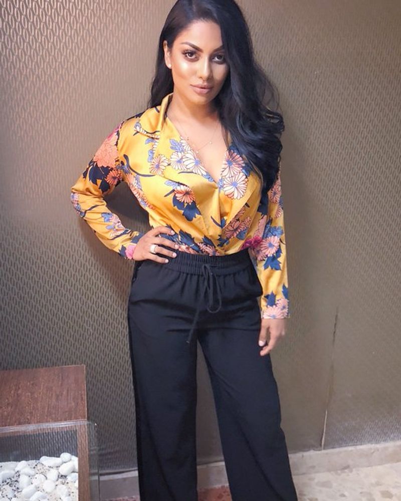 Tamil actress who plays rugby in a dark room with cricketers