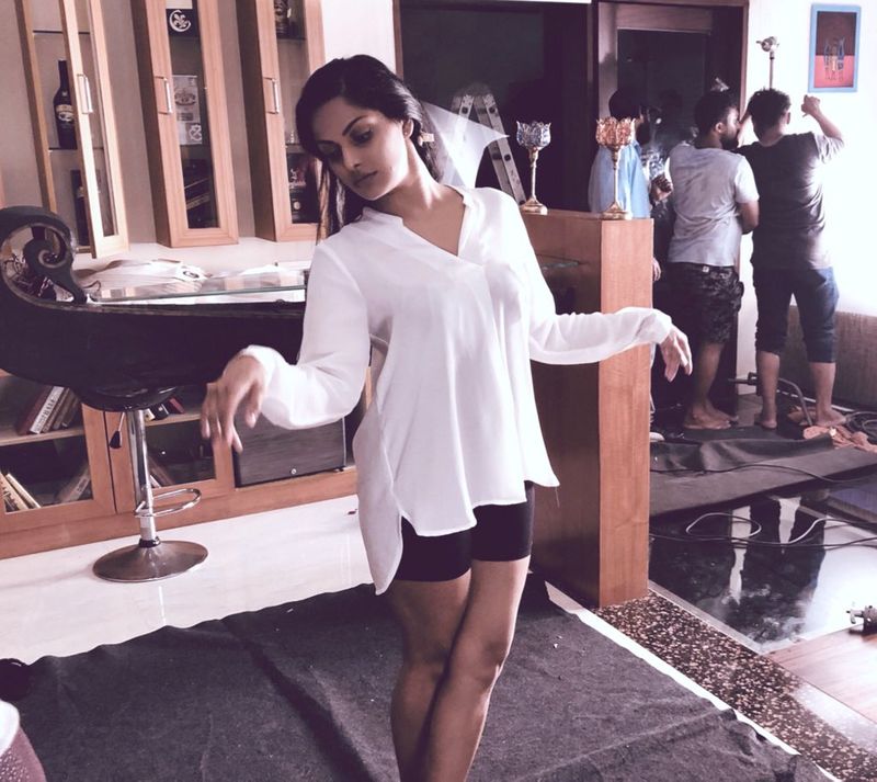 Tamil actress who plays rugby in a dark room with cricketers
