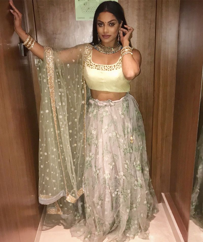 Tamil actress who plays rugby in a dark room with cricketers