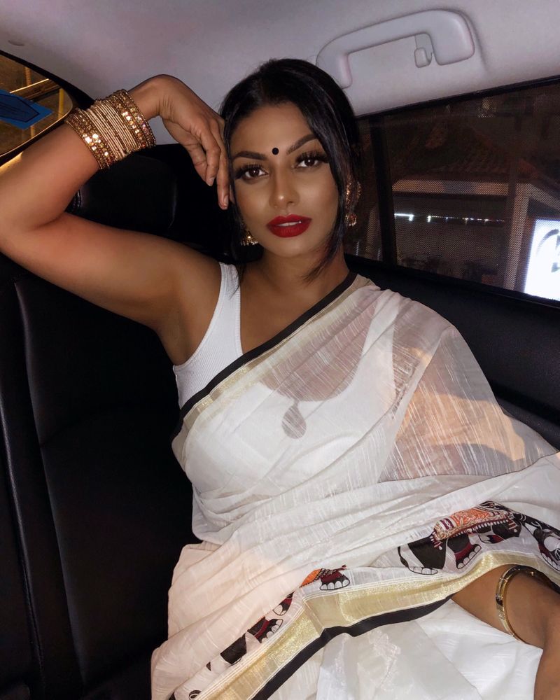 Tamil actress who plays rugby in a dark room with cricketers