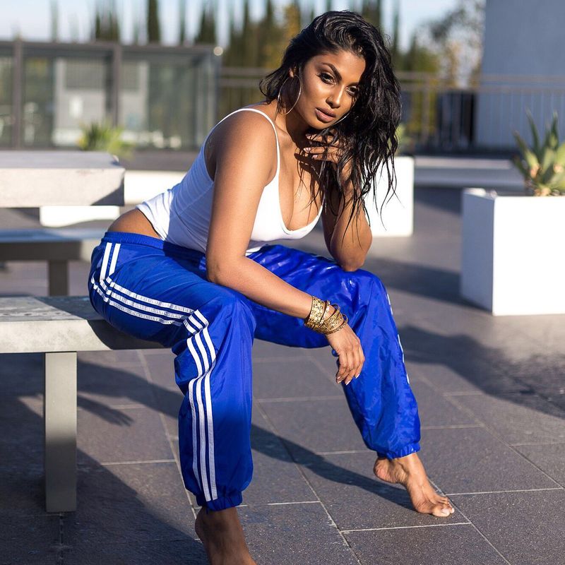 Tamil actress who plays rugby in a dark room with cricketers