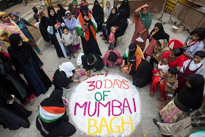women in front of against national citizenship amendment bill photo story