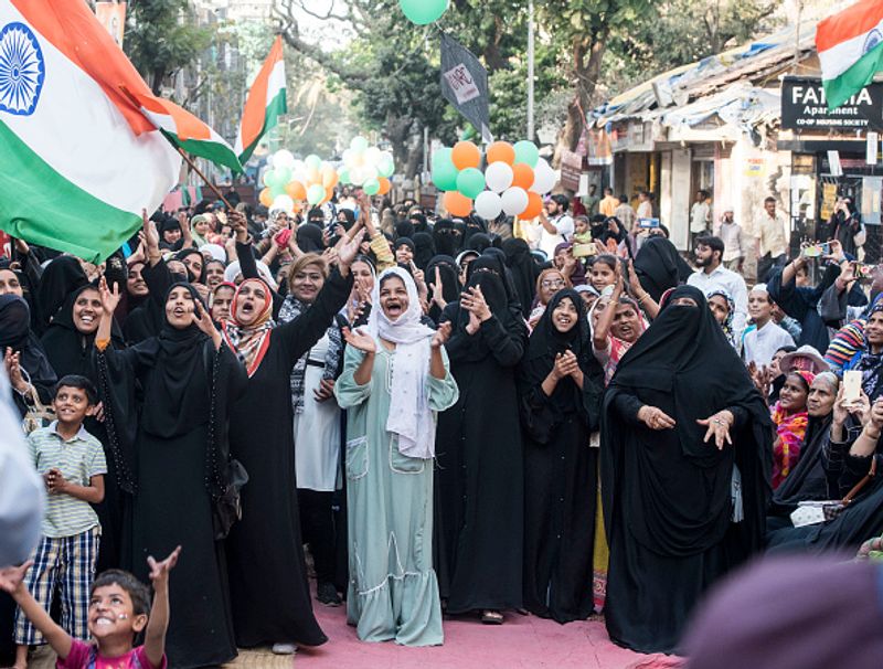 women in front of against national citizenship amendment bill photo story