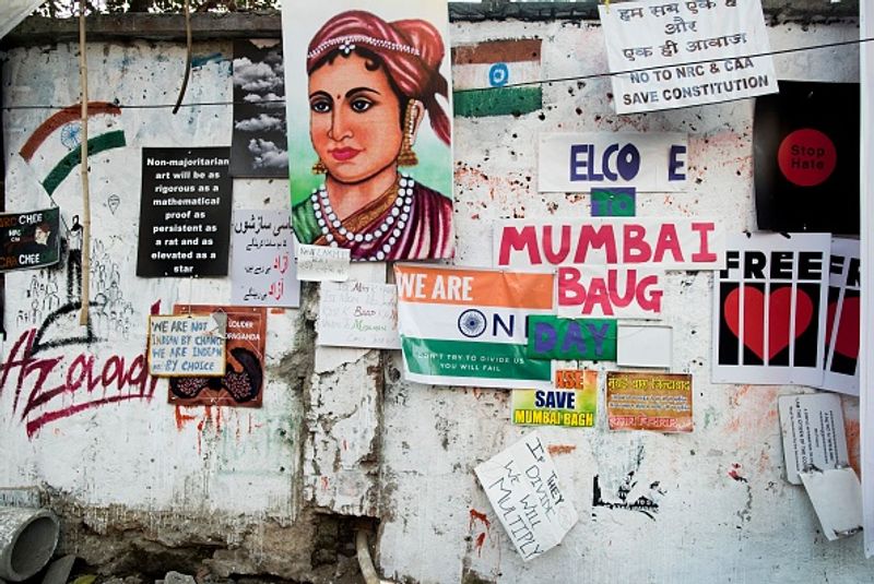 women in front of against national citizenship amendment bill photo story