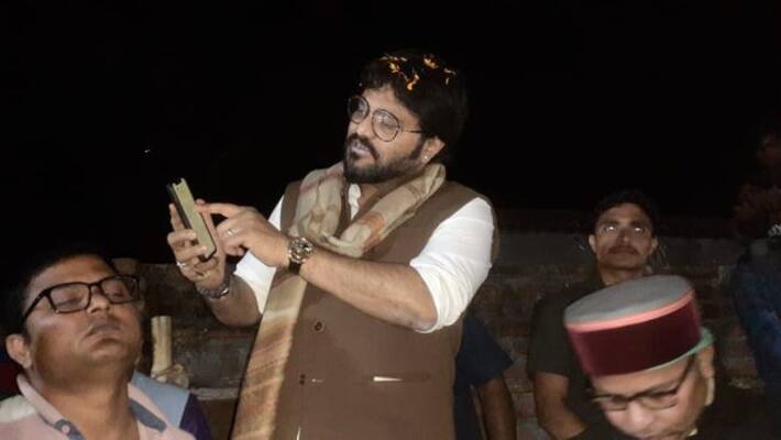 Babul Supriyo entered the village with the torch light of his mobile phone Babul Supriyo entered the village with the torch light of his mobile phone