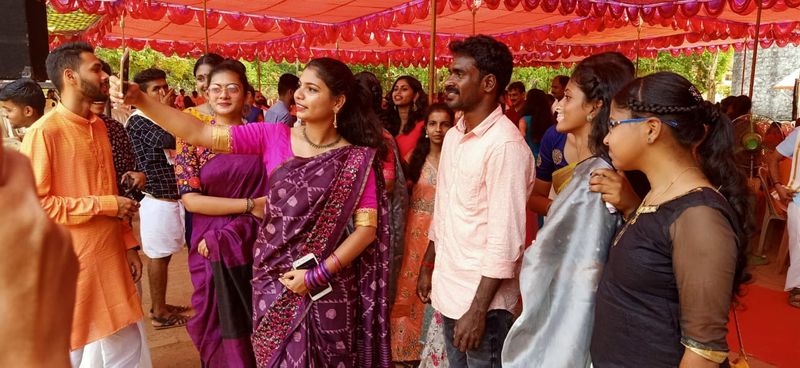 Photo gallery of Kambala buffalo jockey Srinivas Gowda poses to selfie with students