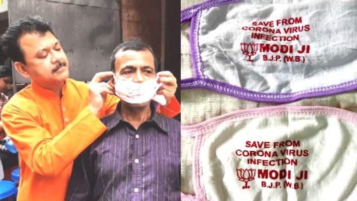 Bengal BJP distributes Modi mask to protect people from Corona Bengal BJP distributes Modi mask to protect people from Corona