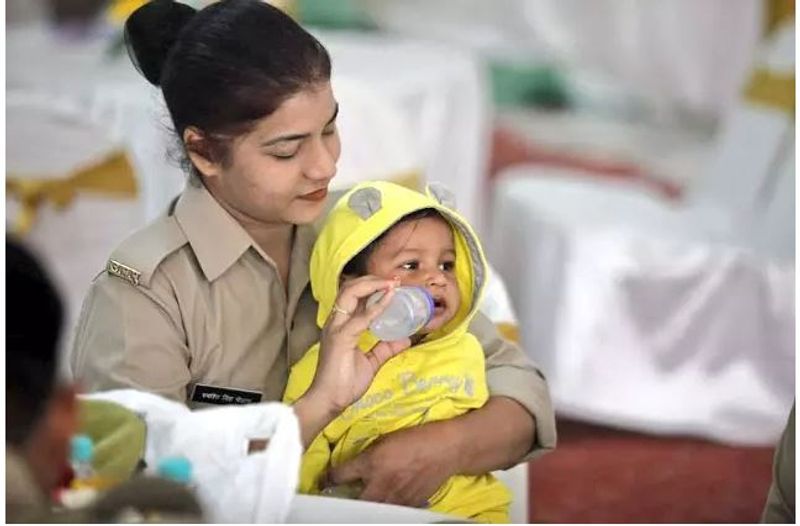 womens day 2020 mother hold baby on duty isnpiring stories kpt