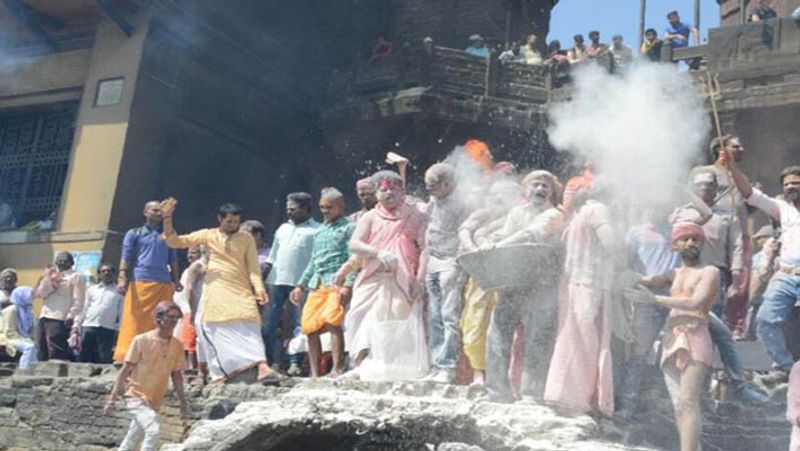 shiva devotees celebrate chita bhasma holi at the cremation ground kpl