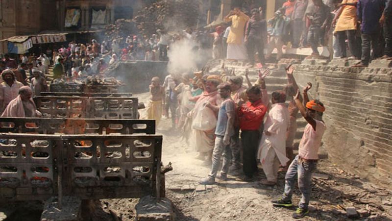 shiva devotees celebrate chita bhasma holi at the cremation ground kpl