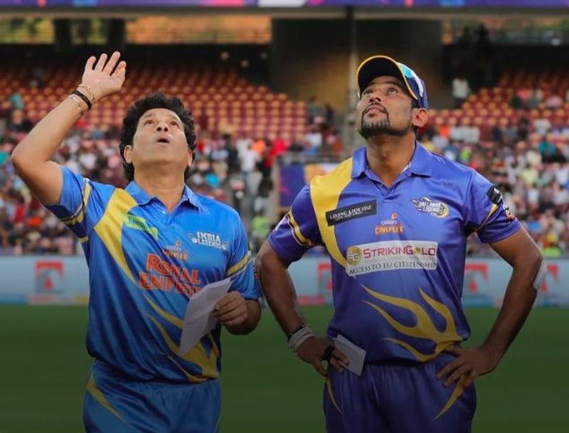 India Legends captain Sachin Tendulkar flips the coin at the toss as Sri Lanka Legends skipper Tillakaratne Dilshan watches. Tendulkar won the toss and opted to field first