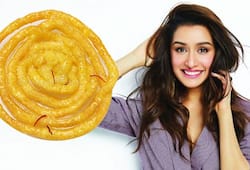 Shraddha Kapoor cant hide her glee as Tiger Shroff gifts giant jalebi on her birthday