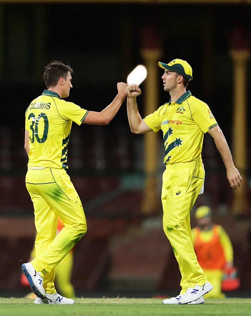Photos empty stadium no handshakes Australia-New Zealand ODI players celebrate touching elbows fists