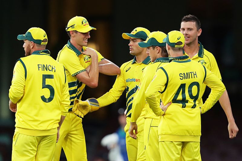 Photos empty stadium no handshakes Australia-New Zealand ODI players celebrate touching elbows fists