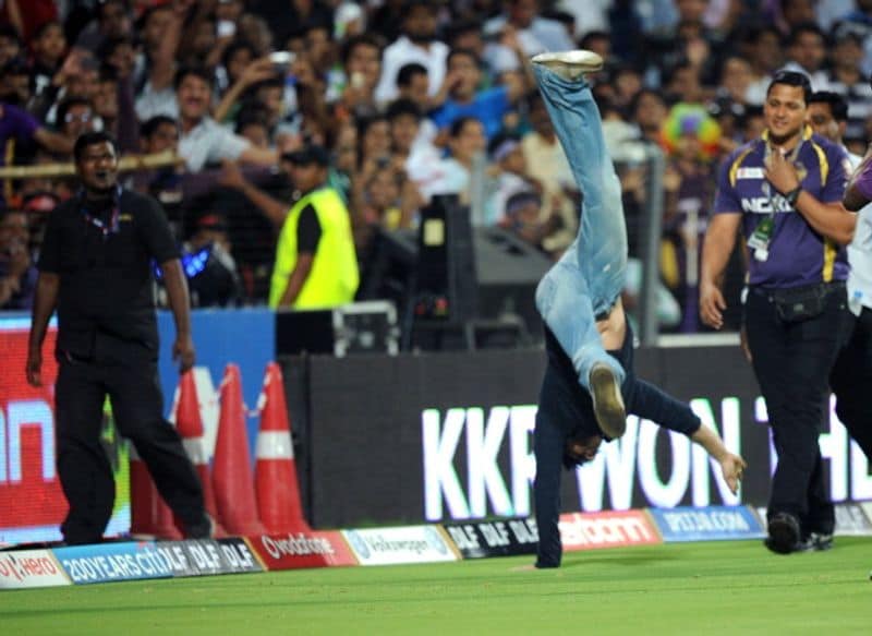 Kolkata Knight Riders (KKR) owner Shah Rukh Khan does a somersault after his team won the IPL playoff match against Delhi Daredevils at Subrata Roy Sahara Stadium in Pune on May 22, 2012