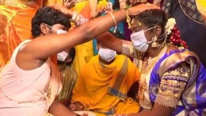 couple get married in masks in andhra pradesh amid coronavirus couple get married in masks in andhra pradesh amid coronavirus