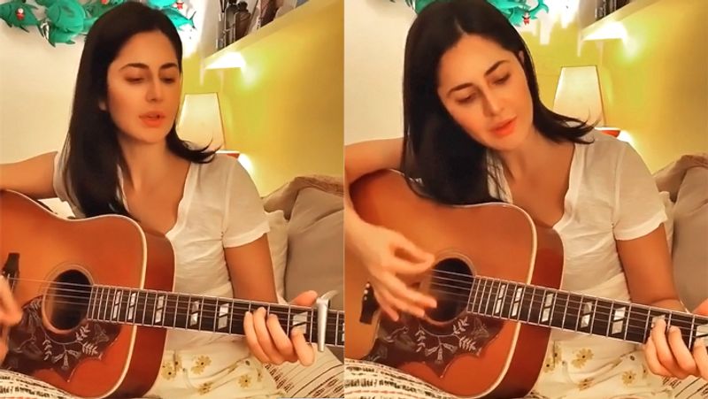 After washing dishes Katrina kaif picks up a broom and clean her room