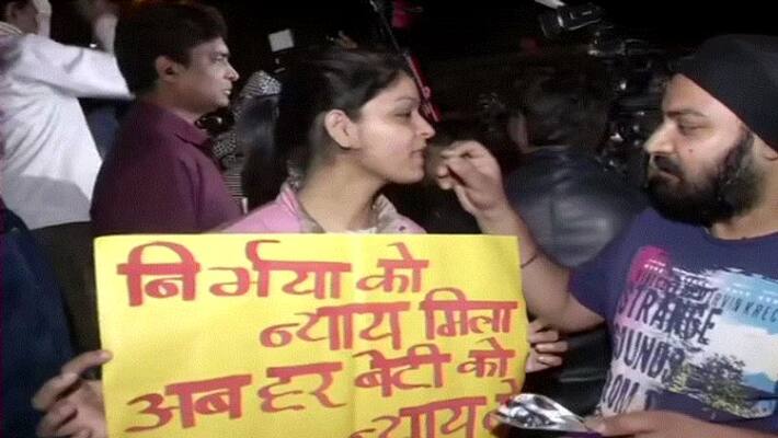 People celebrate distribute sweets outside Tihar Jail after fore convicts hanged People celebrate distribute sweets outside Tihar Jail after fore convicts hanged