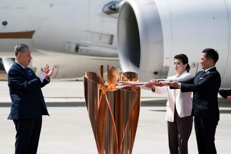 Olympic torch arrives in Japan with little fanfare as coronavirus threatens Games