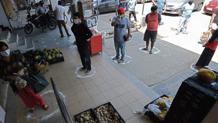 coronavirus lockdown in india social distancing images for Shopkeeper kpr