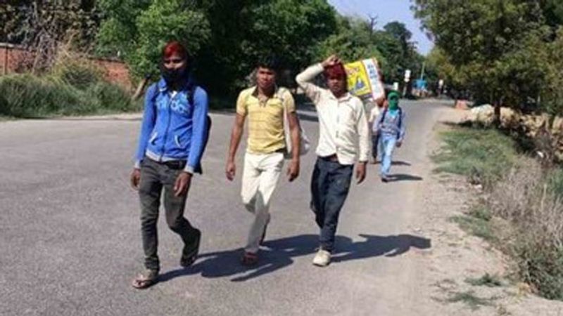 people returning home walking hundreds of km to save lives from Corona kpl