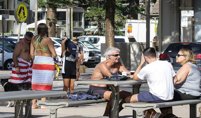 crowd gathered on australian roads and beaches to enjoy during corona outbreak can help spread virus rapidly kph