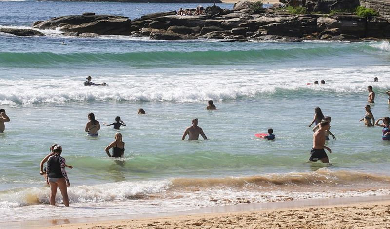 crowd gathered on australian roads and beaches to enjoy during corona outbreak can help spread virus rapidly kph