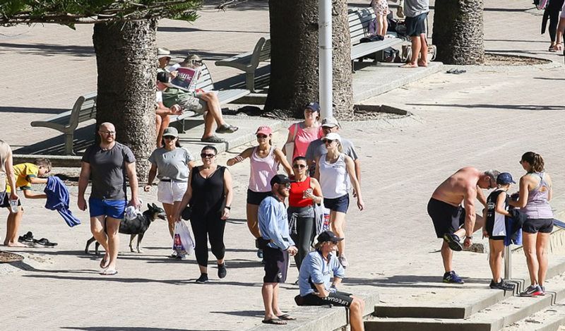 crowd gathered on australian roads and beaches to enjoy during corona outbreak can help spread virus rapidly kph