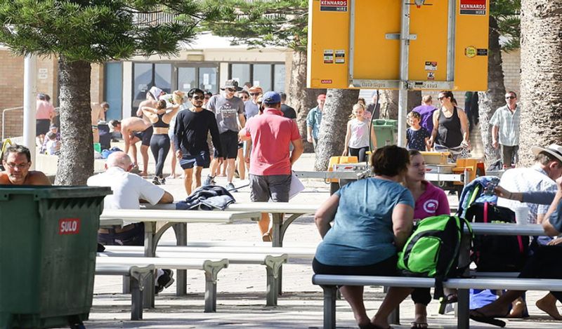 crowd gathered on australian roads and beaches to enjoy during corona outbreak can help spread virus rapidly kph