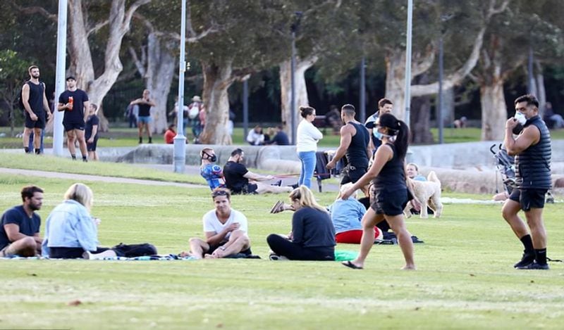 crowd gathered on australian roads and beaches to enjoy during corona outbreak can help spread virus rapidly kph