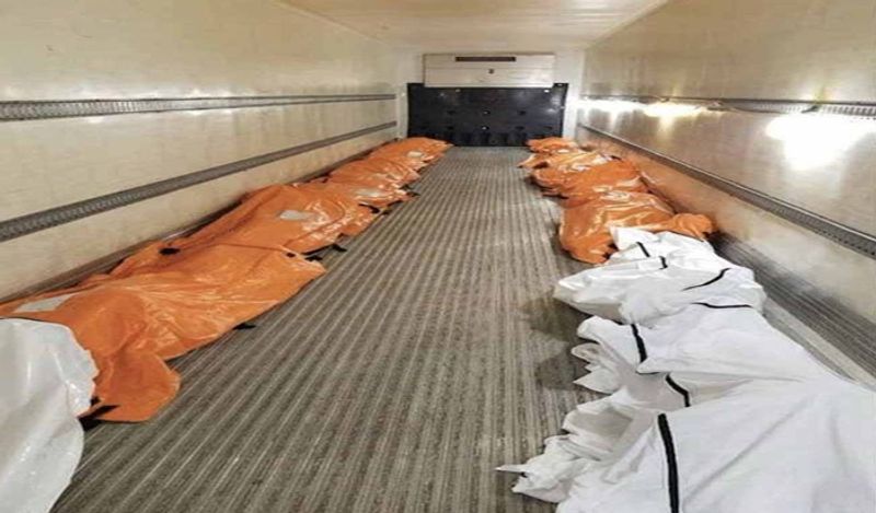 shocking photos of american corona virus dead bodies loaded in refrigerated trucks kph