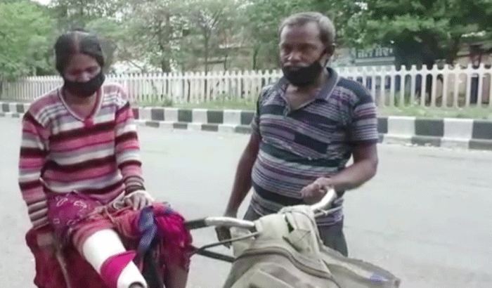 coronavirus lockdown emotional story husband carried his injured wife on bicycle in hospital kpr coronavirus lockdown emotional story husband carried his injured wife on bicycle in hospital kpr