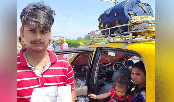 यह तस्वीर झारखंड की है। टैक्सी में बैठी जिस महिला की गोद में वह बच्ची है उसको ट्यूमर है। माता-पिता अपनी बेटी का ऑपरेशन के बाद घर ले जा रहे थे, लेकिन रास्ते में फंस गए।