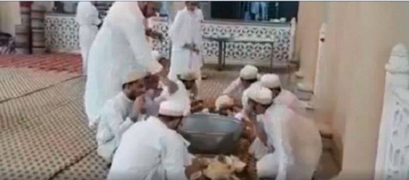 fact check of video shows Muslims licking utensils to spread corona virus
