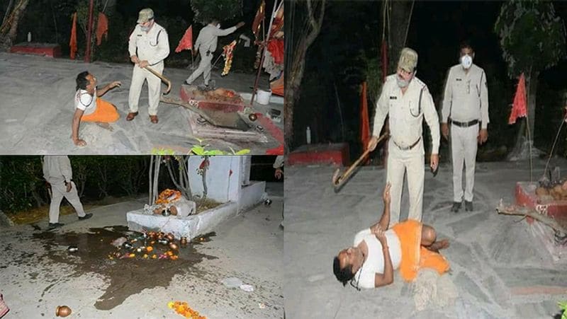 दरअसल, यह वीडियो मध्यप्रदेश के रीवा शहर का है जहां पुलिस को सूचना मिली थी की एक धार्मिक स्थान पर 50 से अधिक लोग खड़े हैं। जिसके बाद पुलिस शहर के ढेकहा स्थित देवी मंदिर पहुंची और वहां खड़े भीड़ को खदेड़ दिया। इसी दौरान एक पुलिस वाले ने मंदिर के पुजारी की जमकर पिटाई कर दी । जिसका वीडियो अब वायरल हो रहा है।