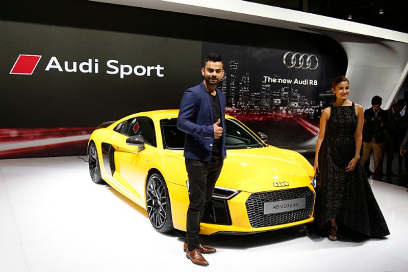Kohli and Bollywood Actres Alia Bhatt with RB V10 Plus Audi during the Indian Auto Expo in Greater Noida on February 3, 2016