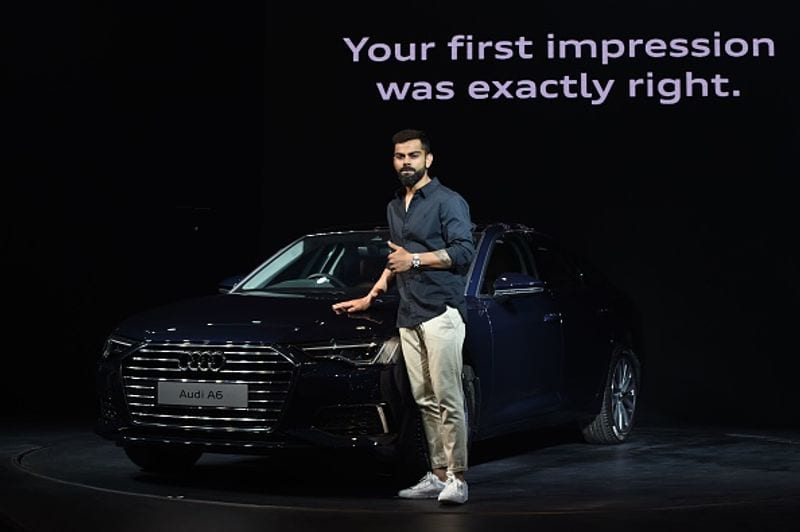 Kohli poses with at a promotional event for the India launch of the Audi A6 car in Mumbai on October 24, 2019.
