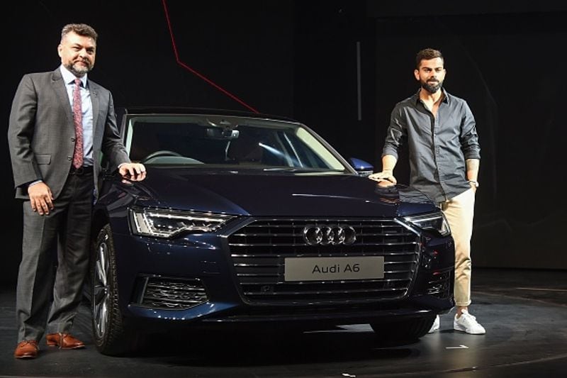 Kohli poses with Audi Q8.
