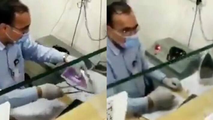 gujarat banker use steam iron to disinfect cheque gujarat banker use steam iron to disinfect cheque