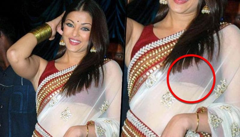 পোশাকের থেকে শরীর প্রদর্শনেও মাতোয়ারা গোটা বলিউড। রেড কার্পেট থেকে স্টেজ শো একাধিকবার পোশাকের কারণে ট্রোলের মুখ পড়েছেন বলি অভিনত্রীরা। সেই তালিকায় রয়েছেন প্রাক্তন বিশ্বসুন্দরী ঐশ্বর্য রাই বচ্চন। নিজের ফ্যাশন স্টেটমেন্টের জন্য তার জনপ্রিয়তাও তুঙ্গে। সাদা রঙের এই শাড়িটি পরে রাভানের একটি মিউজিক লঞ্চের অনুষ্ঠানে গিয়েছিলেন অভিনেত্রী। আর সেখানেই ব্লাউজের ফাঁক দিয়ে তার বক্ষযুগল দেখা যায়। যা প্রকাশ্যে আসা মাত্রই ট্রোলের শিকার হয়েছিলেন।