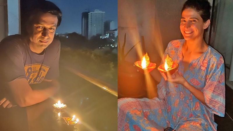 अपने-अपने घरों में रोशनी करते डायरेक्टर मधुर भंडारकर और एक्ट्रेस अहाना कुमरा।