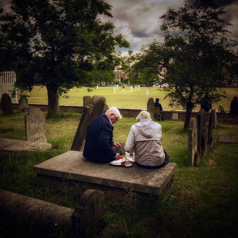 Shortlisted: Derek Payne (Amateur) A couple enjoys afternoon tea in the graveyard of St Anne’s church while watching cricket on Kew Green, close to the Royal Botanic Gardens. June 9, 2019, London, England. Photo courtesy: MCC.