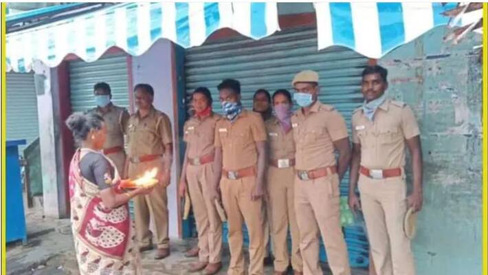 The woman who honored the cop and Taking aarathi The woman who honored the cop and Taking aarathi
