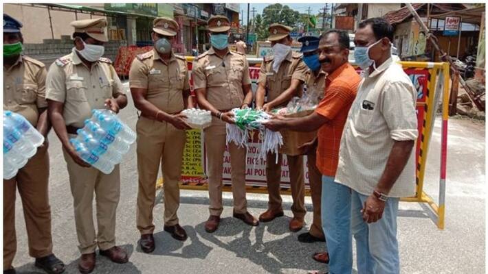 Kerala police association provides water, sanitiser and mask for tamilnadu police who works in border check post Kerala police association provides water, sanitiser and mask for tamilnadu police who works in border check post