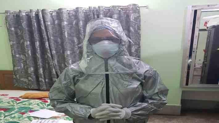 JLNMCH lady doctor geeta rani made ppe suit by car cover pra JLNMCH lady doctor geeta rani made ppe suit by car cover pra