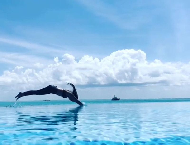 The video seems to be from one of her vacations. In the clip, she is seen jumping into the water, and looks happy.